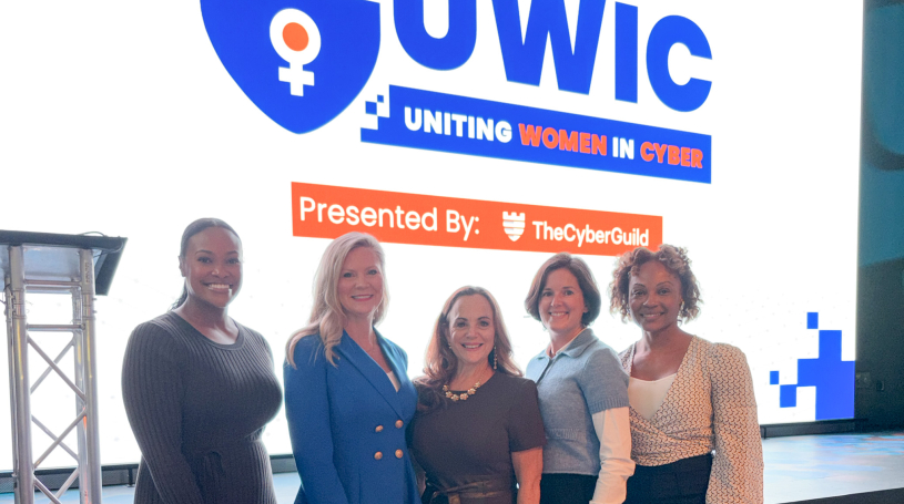 Attendees gathered at Uniting Women in Cyber 2025, held at Amazon HQ in Pentagon City, with speakers and participants engaging in discussions on cybersecurity, innovation, and workforce diversity.